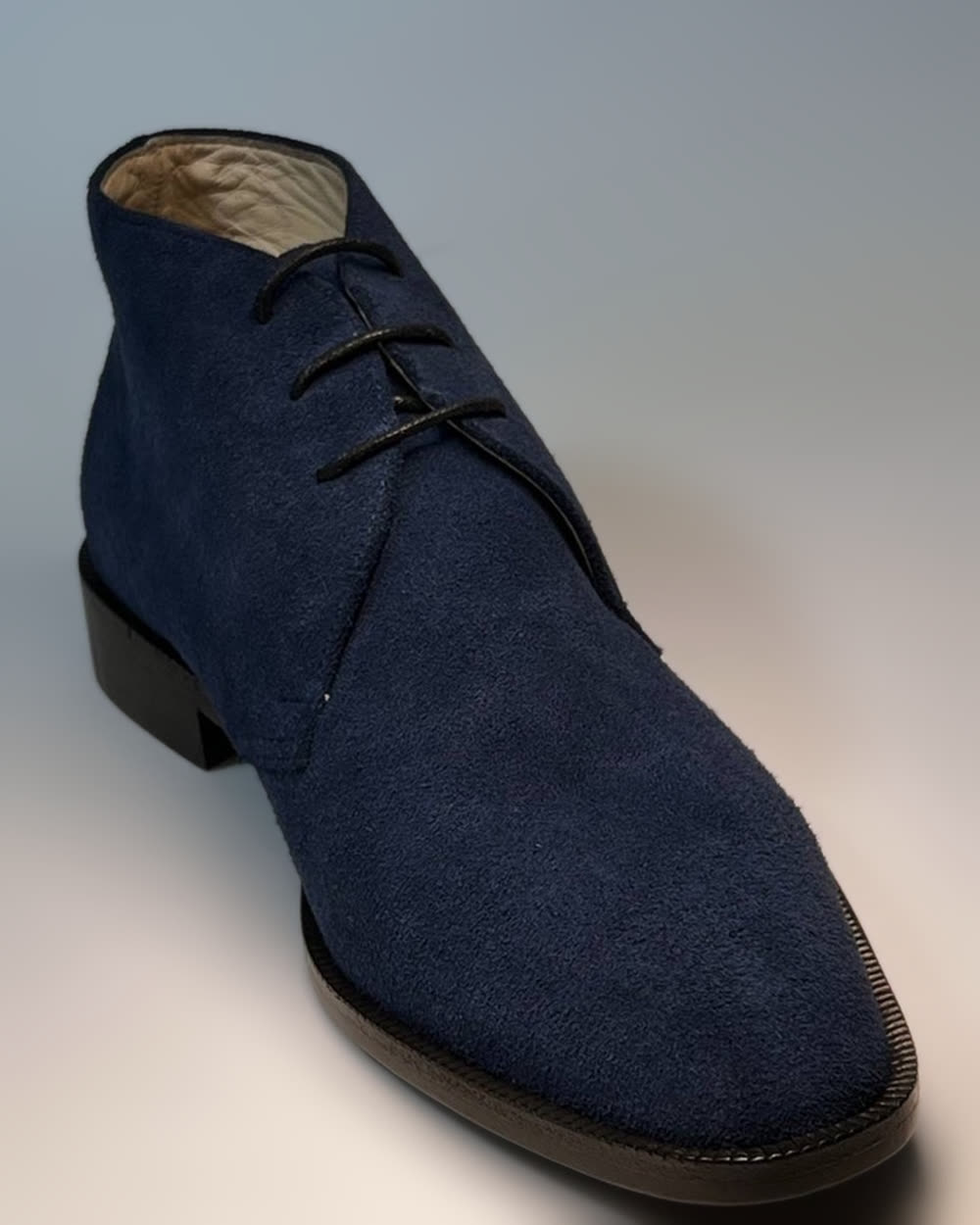 Blue split suede desert boots, black lining, straight welt